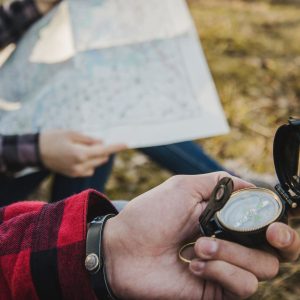 travelers-with-compass-map